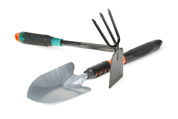 Small shovel and weeder to work in the garden on white background